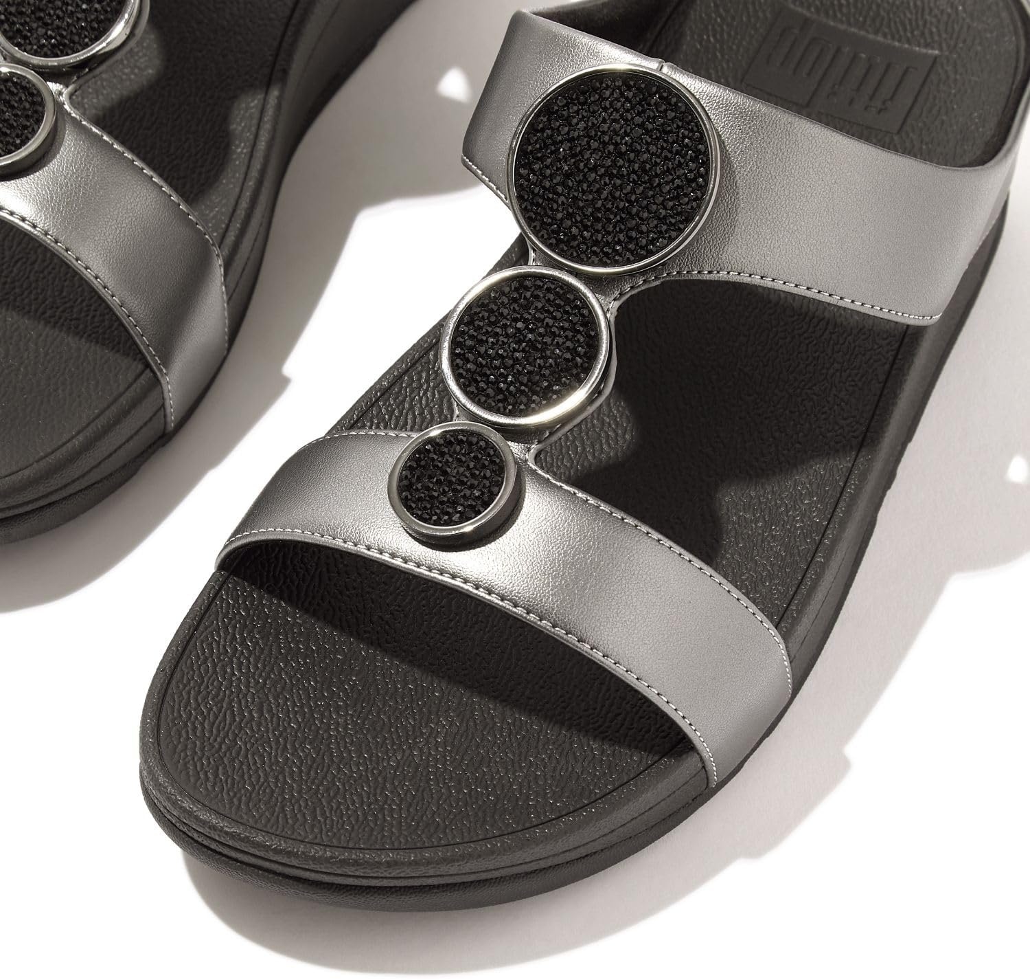 image:imageFitFlop Womens Halo BeadCircle Metallic Hbar Slides Wedge Sandal Leather SlipOn with Microwobbleboard Technology amp Slip Resistant Rubber Outsole Comfortable Footwear Synthetic Rhinestones Ornamented SlipOnPewter Black