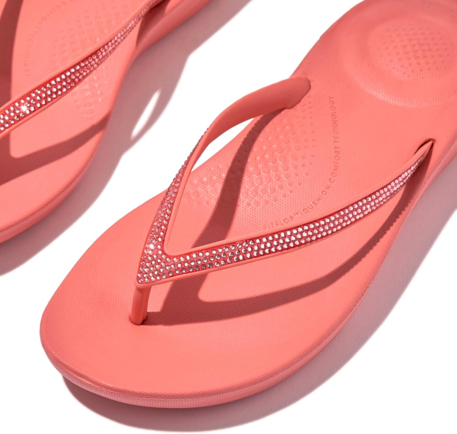image:imageFitFlop Womens iQushion Sparkle Ergonomic Flip Flops for Walking Lightweight Waterproof Cushioned Thong Sandals for Women with Non Slip Bottom and Arch Support Lightweight Waterproof Walking Sandals wCushioned Comfort amp Arch SupportRosy Coral