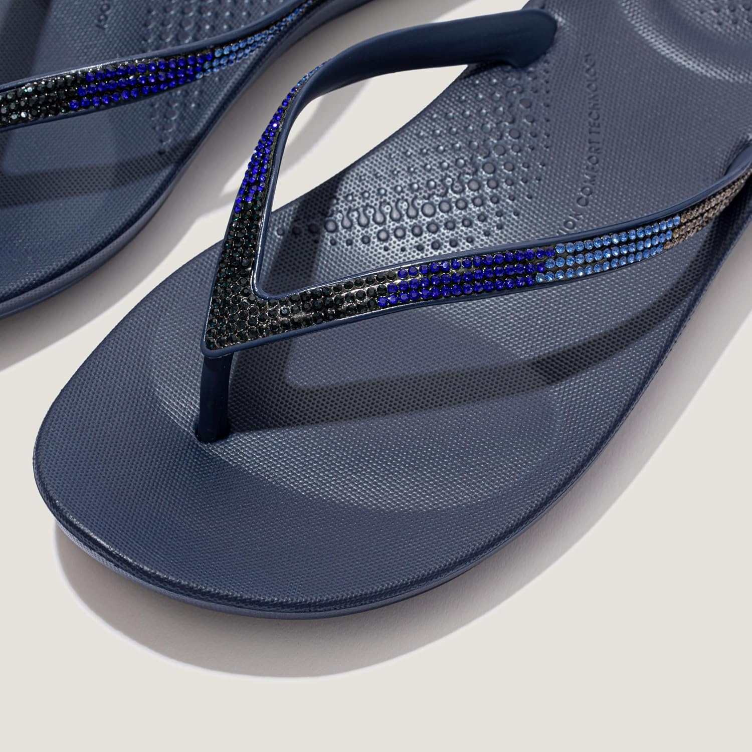 image:imageFitFlop Womens iQushion Sparkle Ergonomic Flip Flops for Walking Lightweight Waterproof Cushioned Thong Sandals for Women with Non Slip Bottom and Arch Support Lightweight Waterproof Walking Sandals wCushioned Comfort amp Arch SupportMidnight Navy