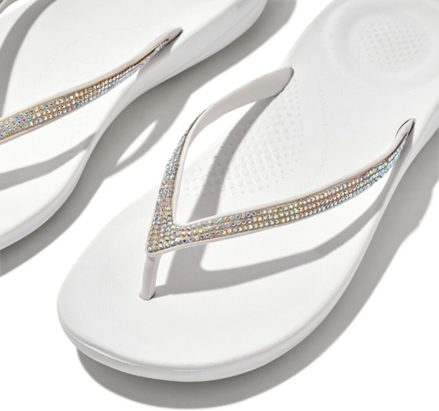image:imageFitFlop Womens iQushion Sparkle Ergonomic Flip Flops for Walking Lightweight Waterproof Cushioned Thong Sandals for Women with Non Slip Bottom and Arch Support Lightweight Waterproof Walking Sandals wCushioned Comfort amp Arch SupportUrban White
