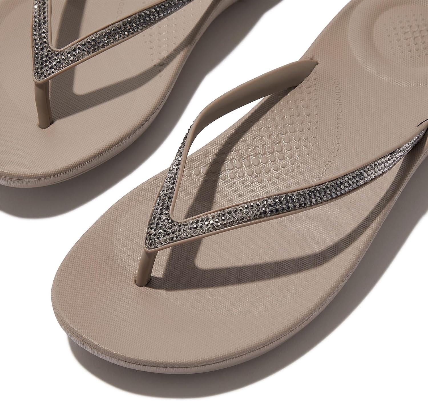 image:imageFitFlop Womens iQushion Sparkle Ergonomic Flip Flops for Walking Lightweight Waterproof Cushioned Thong Sandals for Women with Non Slip Bottom and Arch Support Lightweight Waterproof Walking Sandals wCushioned Comfort amp Arch SupportTaupePewter