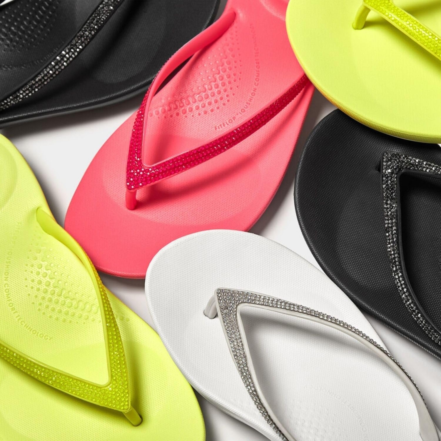 image:imageFitFlop Womens iQushion Sparkle Ergonomic Flip Flops for Walking Lightweight Waterproof Cushioned Thong Sandals for Women with Non Slip Bottom and Arch Support Lightweight Waterproof Walking Sandals wCushioned Comfort amp Arch SupportUrban White