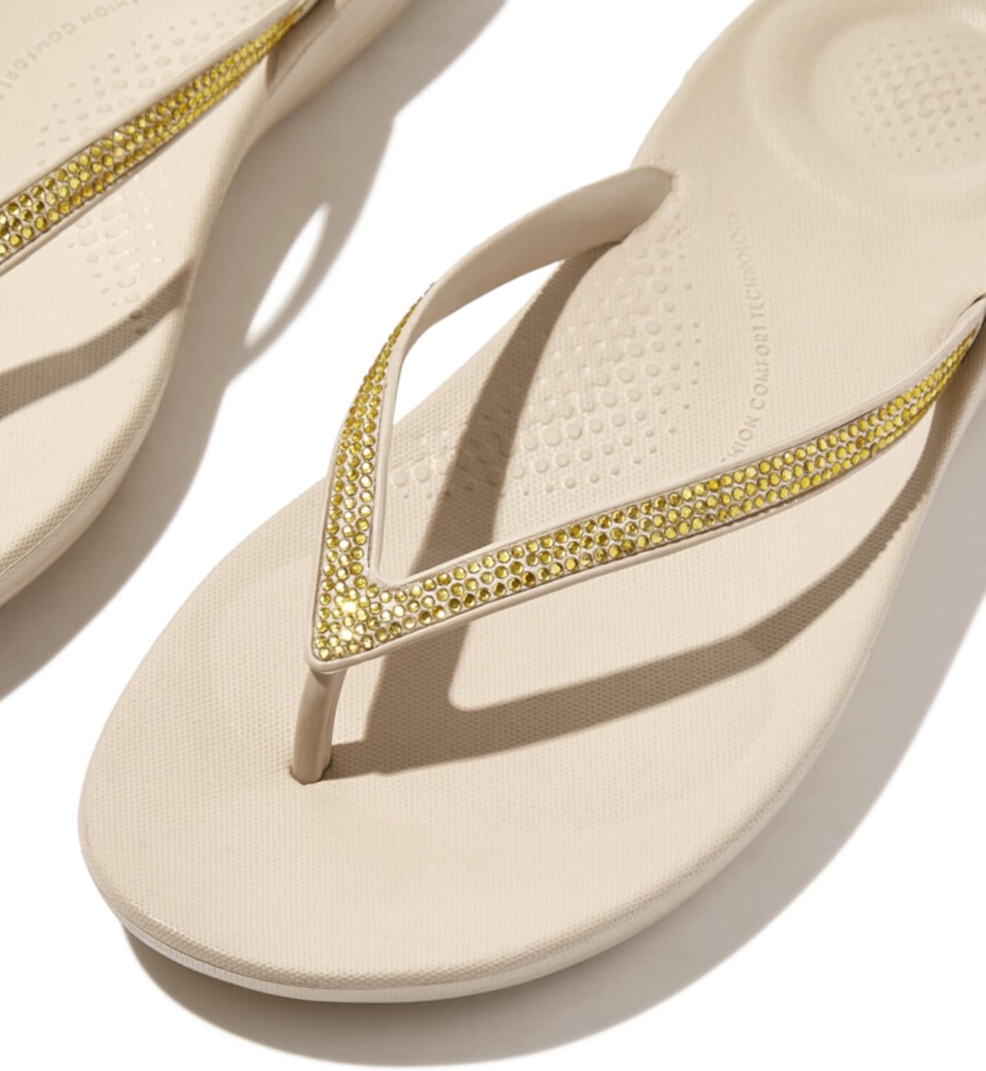 image:imageFitFlop Womens iQushion Sparkle Ergonomic Flip Flops for Walking Lightweight Waterproof Cushioned Thong Sandals for Women with Non Slip Bottom and Arch Support Lightweight Waterproof Walking Sandals wCushioned Comfort amp Arch SupportStone Beige